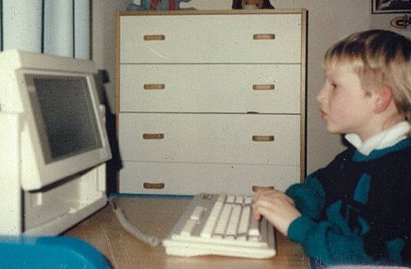 Young Russell Wyatt using a computer in 1987